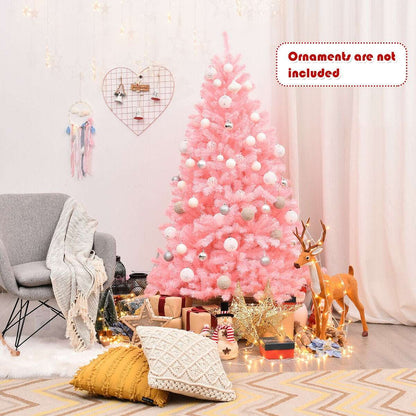 Decorated pink artificial Christmas tree with ornaments and gifts at the base