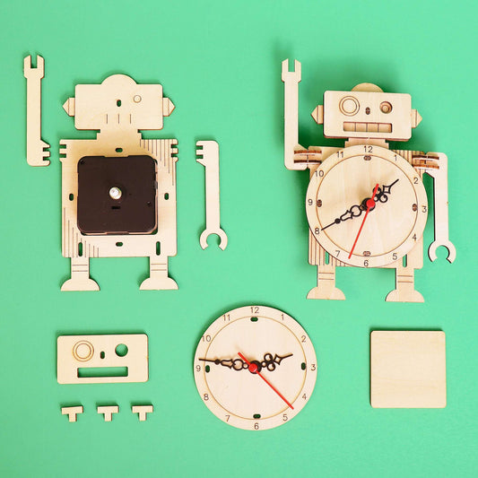 Wooden robot clock DIY kit pieces, with clock face and robot body cutouts