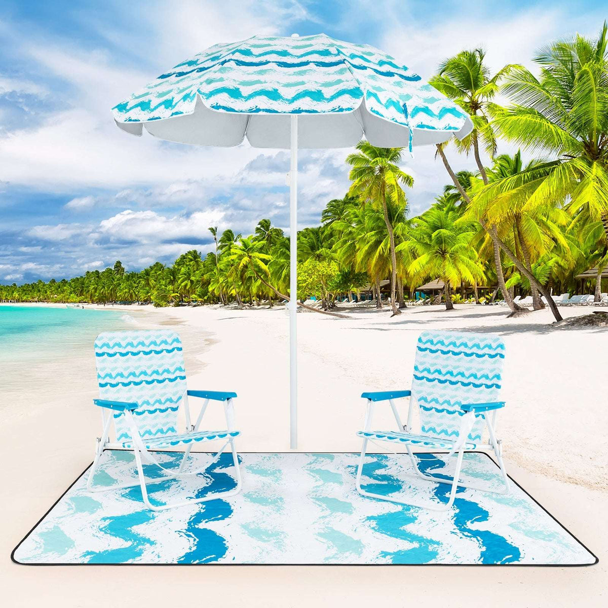 Blue beach umbrella set with two foldable chairs and picnic blanket