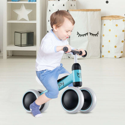 Blue four-wheel baby balance bike with a toddler riding it