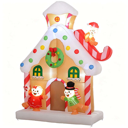 Inflatable gingerbread house with colorful candy dots, wreath, figures and a sleigh-riding snowman