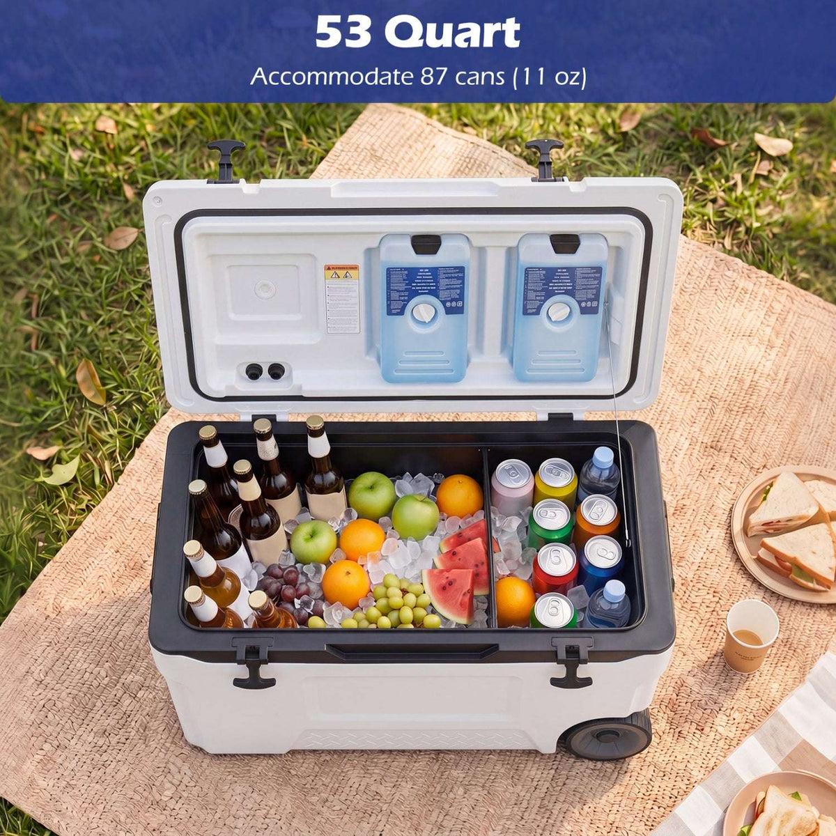 Open white 53-quart rolling cooler packed with drinks, fruit, and ice