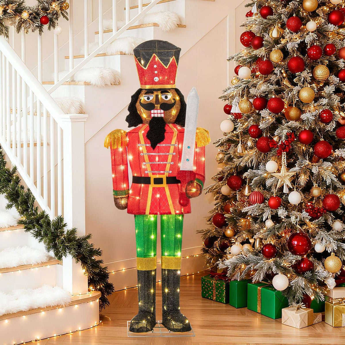Five-foot lighted Christmas nutcracker holding a glitter sword, with a red coat and green trousers