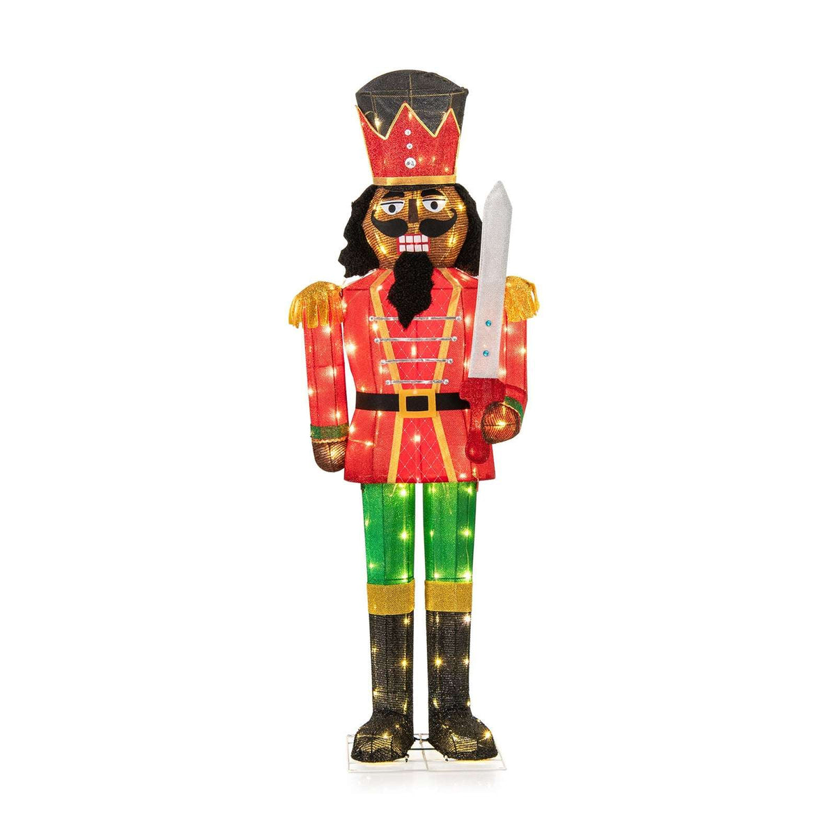 Full view of the lighted nutcracker with crown hat, red coat, green trousers, and sword