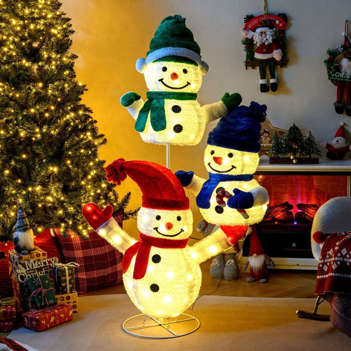 Glowing stacked snowman decoration with red, blue, and green hats and scarves