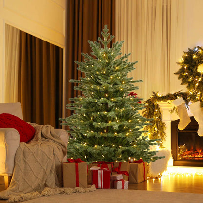 Artificial Christmas tree with warm white lights and a broad, full profile