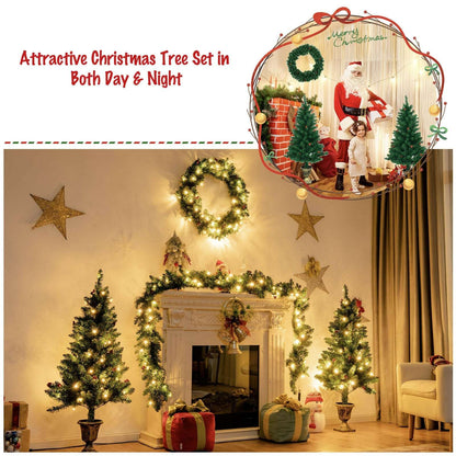 Pre-lit Christmas decor set with two potted trees, wreath, and draped garland