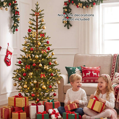 Decorated artificial Christmas tree with warm lights, red and gold ornaments, and gifts