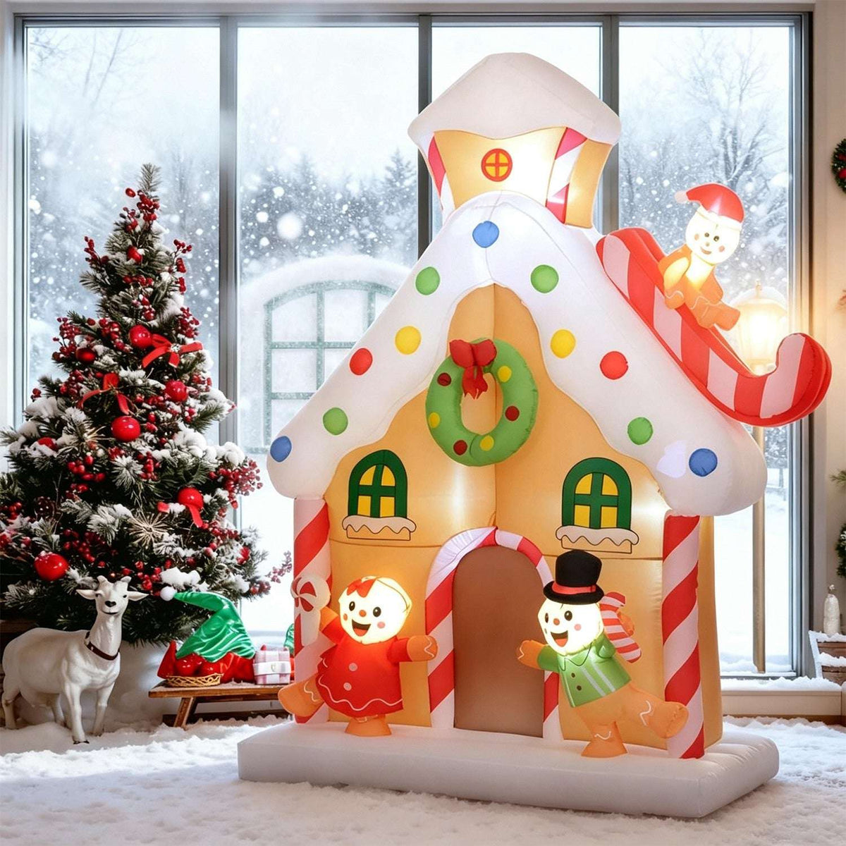 Inflatable gingerbread house with illuminated figures, candy trim, wreath and snowman on a sleigh