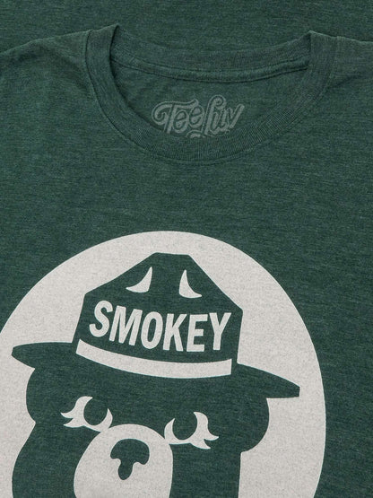 Forest green T-shirt close-up of Smokey Bear hat and front logo graphic