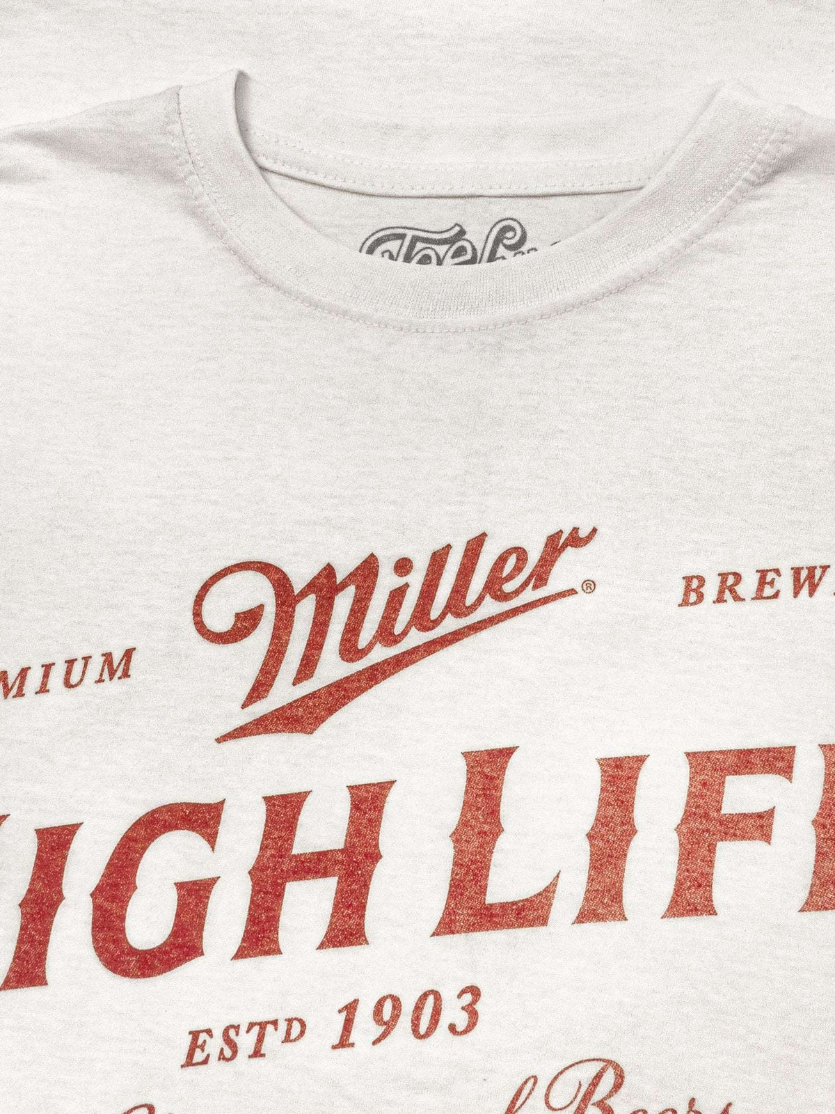 White T-shirt front with Miller logo and red “HIGH LIFE” lettering