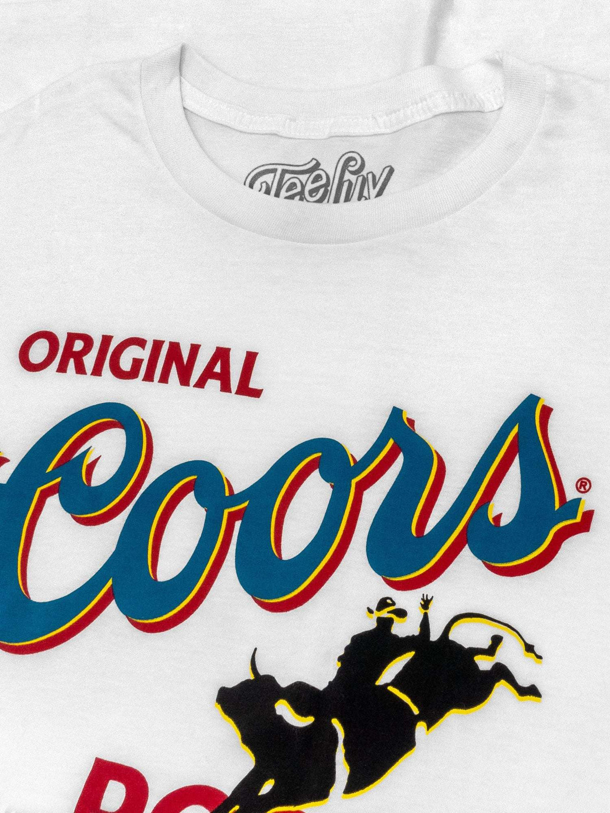 White crew-neck T-shirt close-up with 'Original' and large rodeo logo graphic