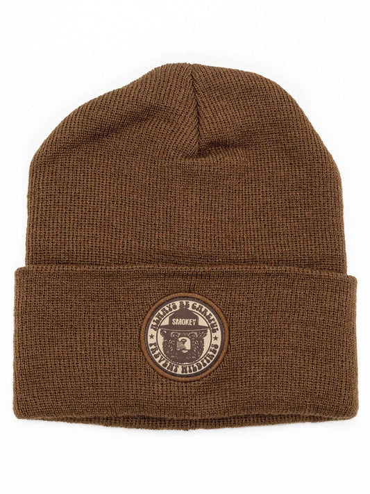 Brown knit beanie with ribbed cuff and Smokey Bear embroidered patch