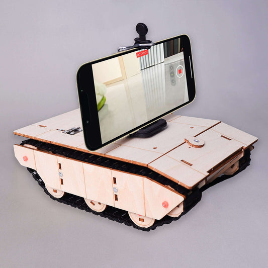 Assembled RC wooden tank kit with smartphone showing camera view
