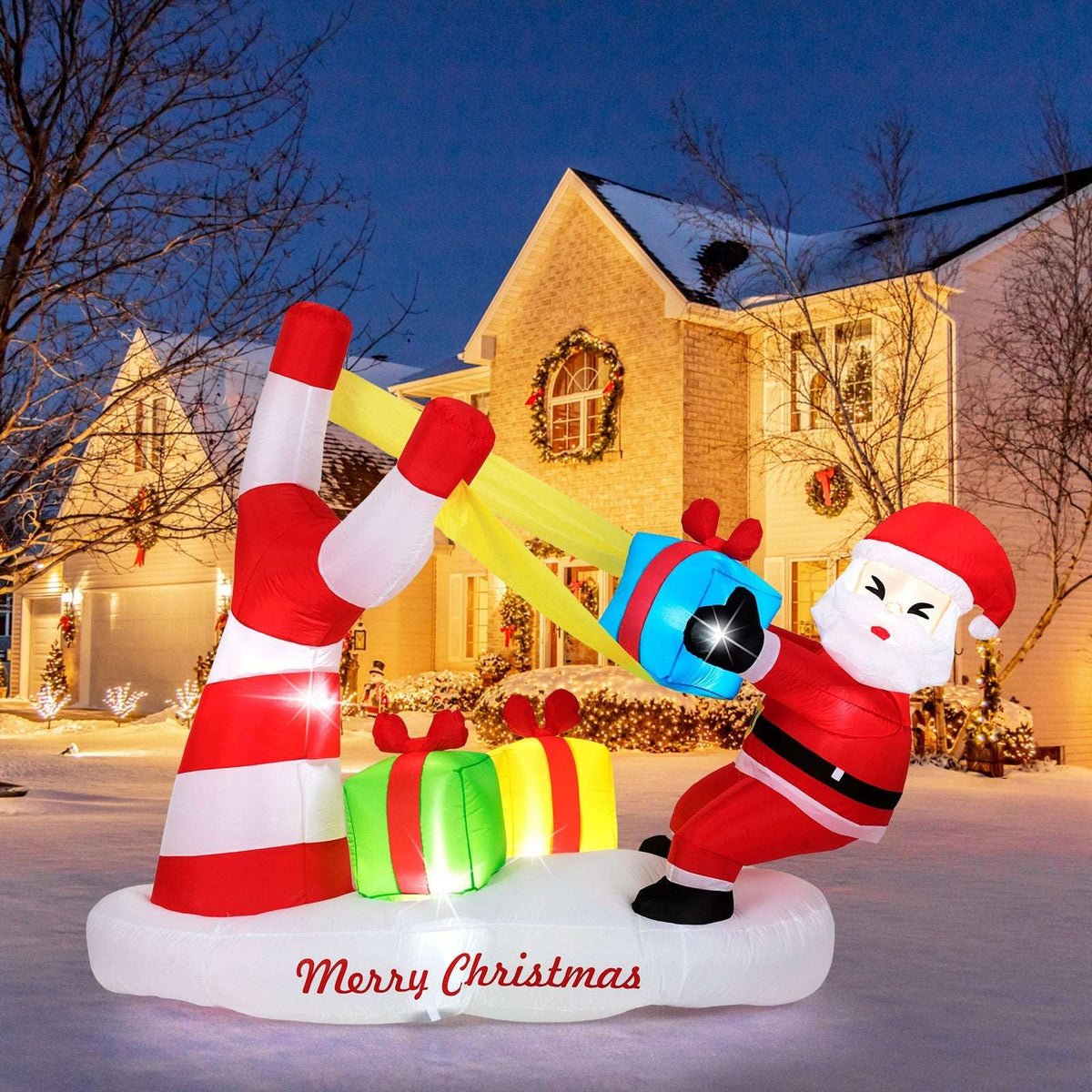 Inflatable Christmas Santa with a slingshot, striped base, gift boxes, and LED lights