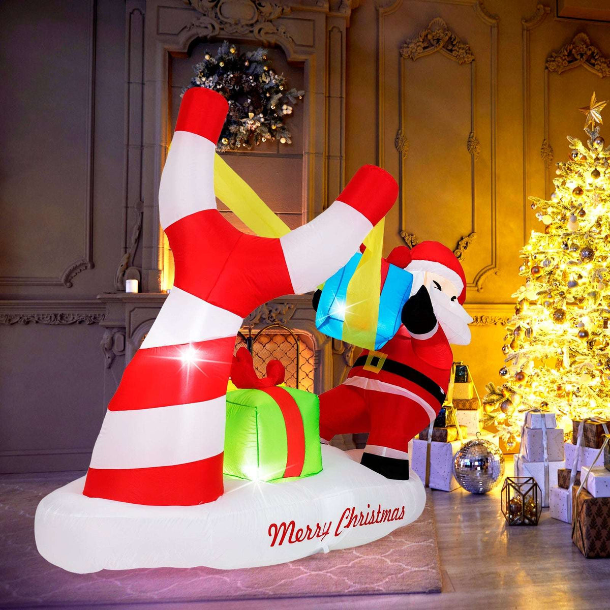 Side view of the inflatable Santa, slingshot, gifts, and striped base