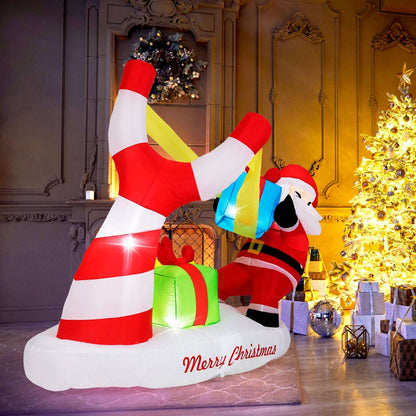 Side view of the inflatable Santa, slingshot, gifts, and striped base