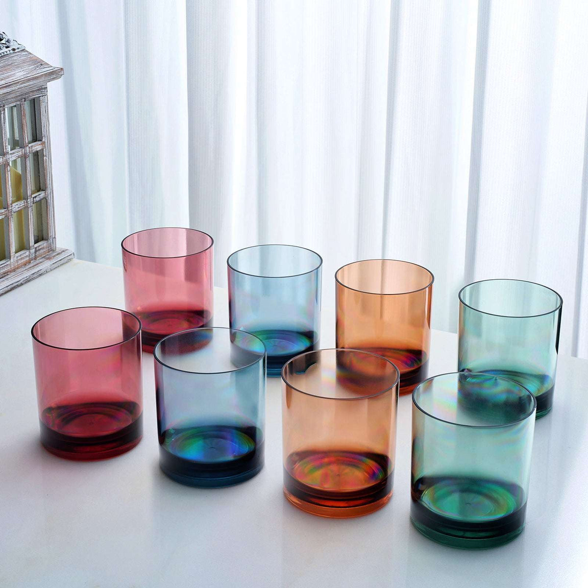 Acrylic lowball tumbler set arranged in tinted cups: pink, blue, amber, teal, green
