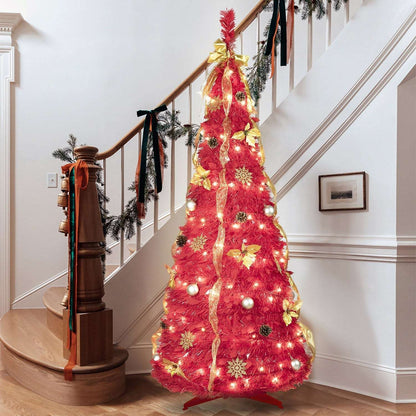 Pre-lit red Christmas tree decorated with gold ribbon, baubles and pine cones