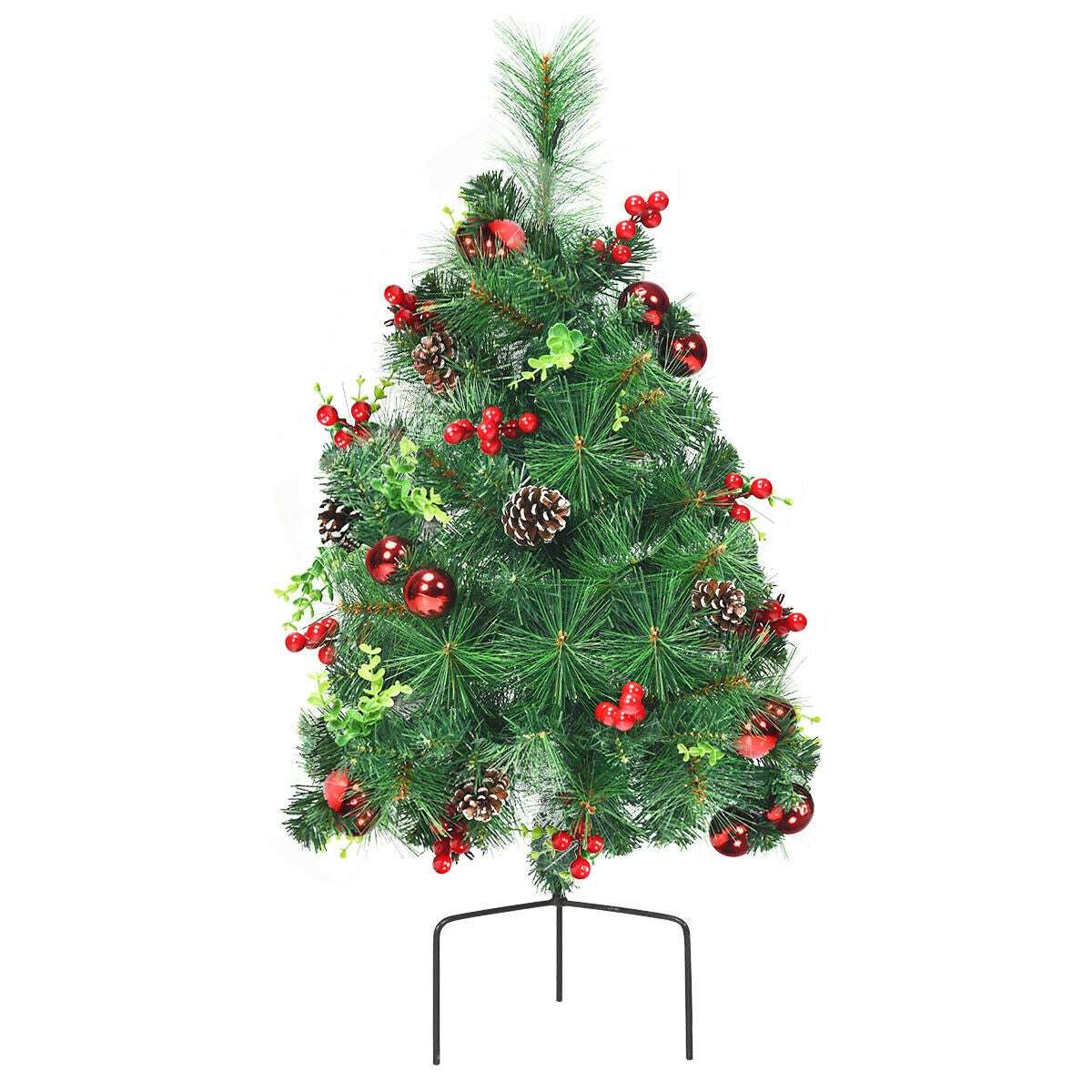 Decorated Christmas tree with red berries, red ornaments, pine cones, and a metal stand