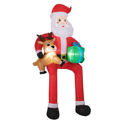 Inflatable Santa with a reindeer and gift, shown against a plain background