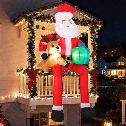 Inflatable Santa with reindeer and gift, shown with glowing built-in lights