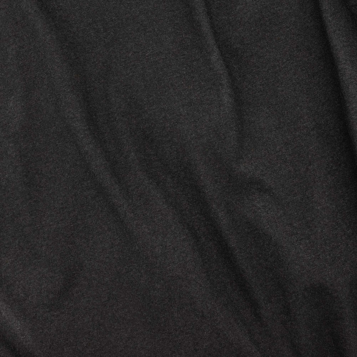 Black T-shirt fabric close-up with smooth knit texture