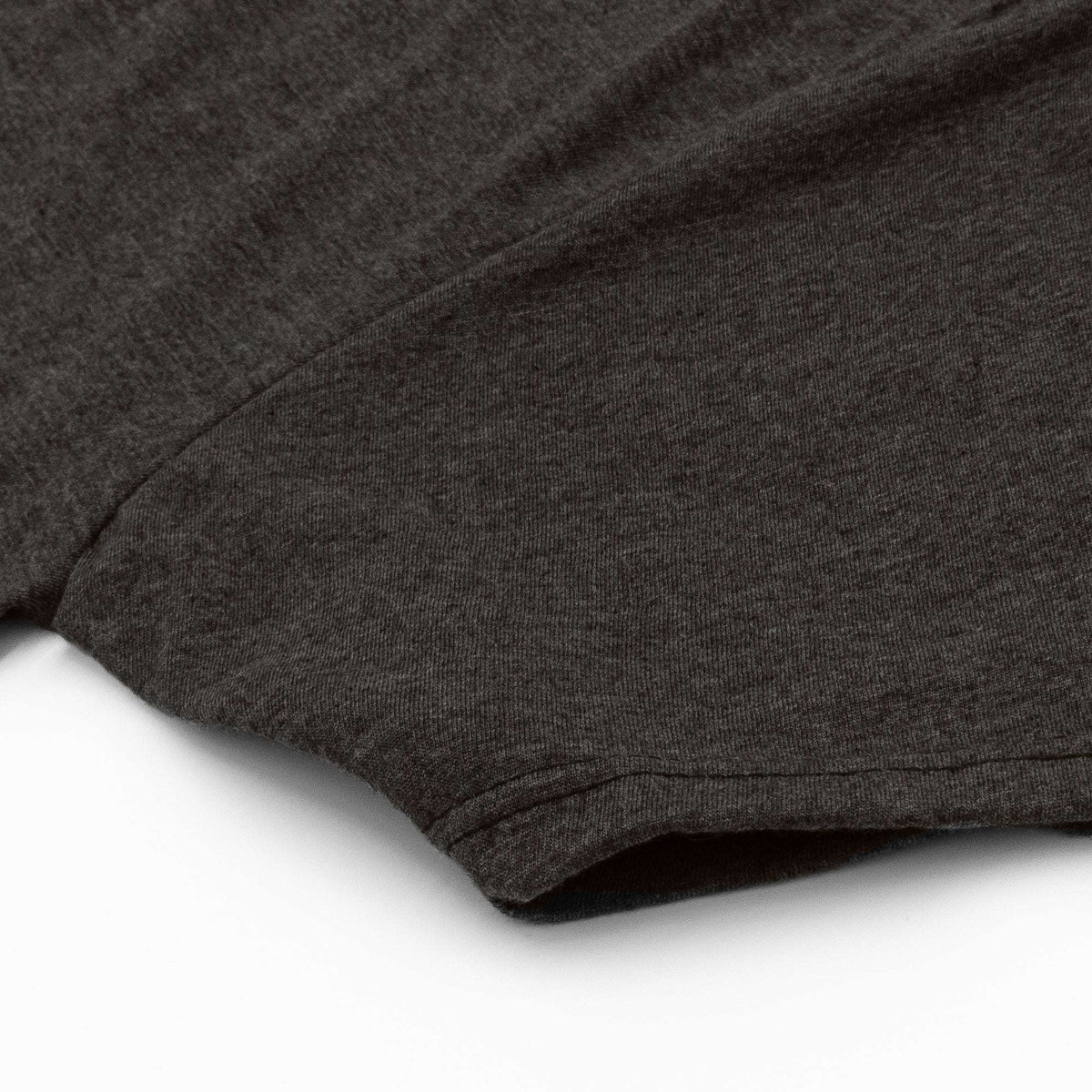 Heather gray T-shirt sleeve and curved hem with visible stitching detail