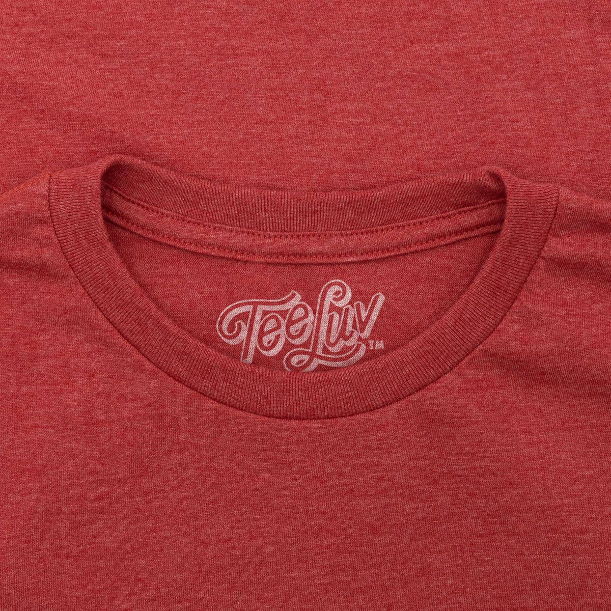 Red crewneck T-shirt with small TeeLuv logo at collar