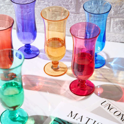 Acrylic hurricane glasses set with stem bases in multicolor, close-up grouping