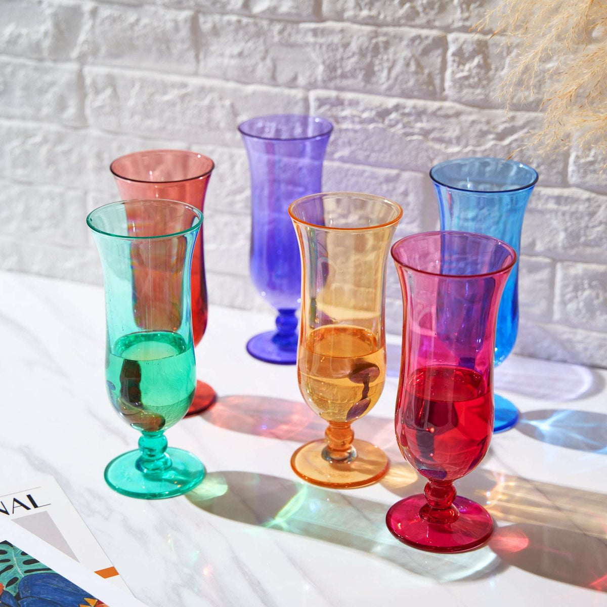 Set of acrylic hurricane glasses, multicolor assortment, each with stem base