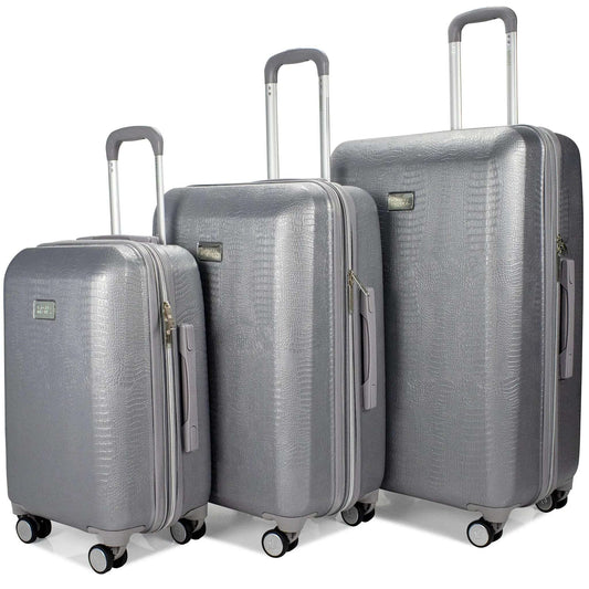 Silver snakeskin-texture luggage set with telescoping handles and spinner wheels