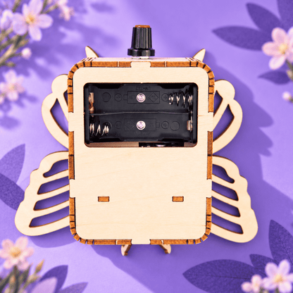 Wooden butterfly mechanical kit back view with battery compartment cover