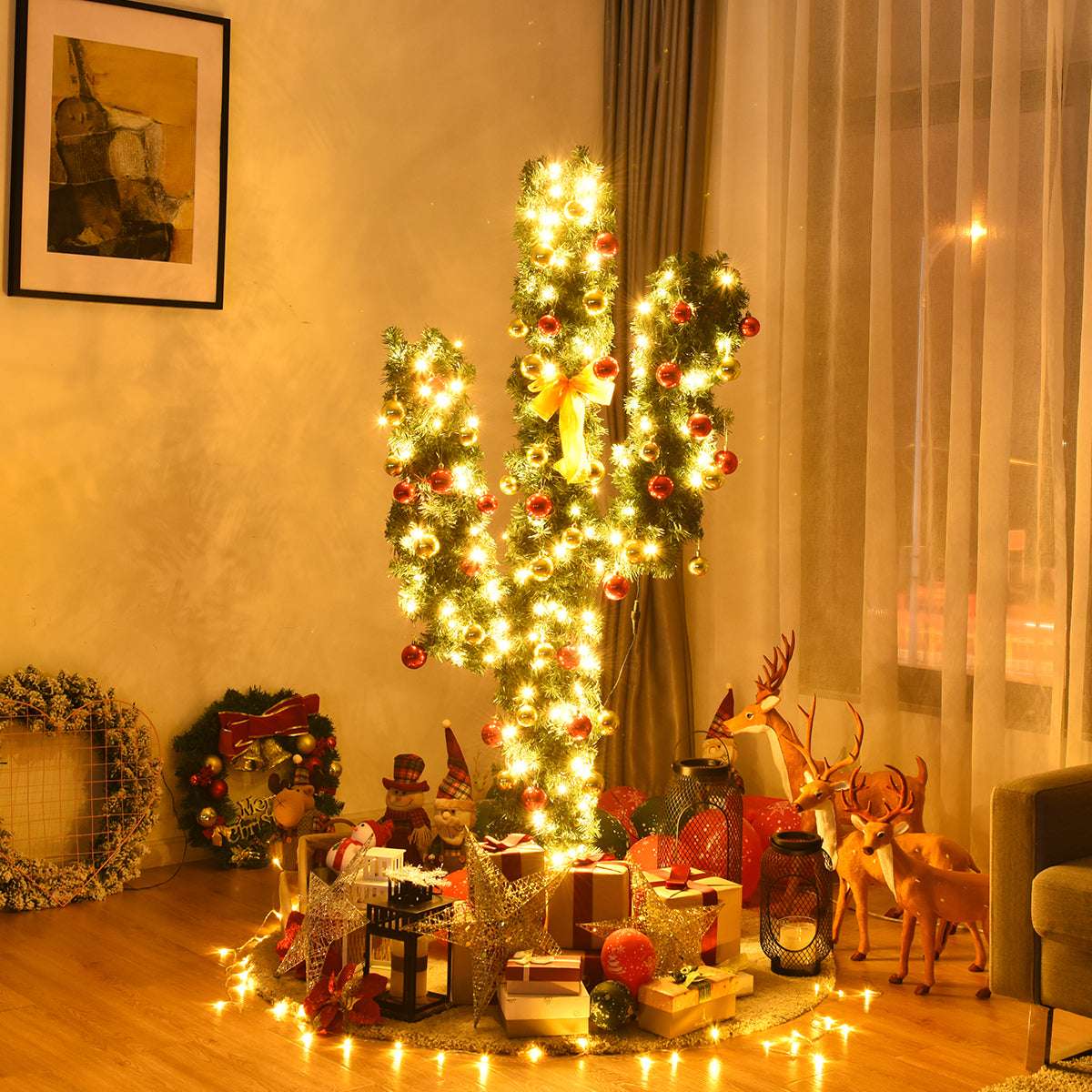 Artificial cactus Christmas tree with warm LED lights and red ornaments in a living room