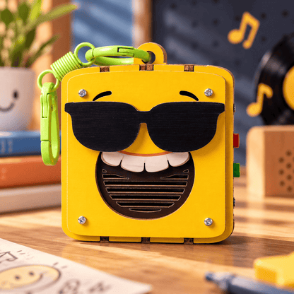 Yellow emoji voice recorder with black sunglasses face and green loop clip