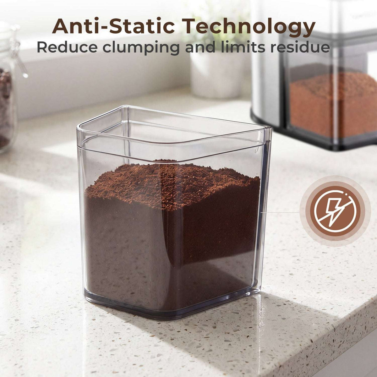 Removable clear grounds container filled with freshly ground coffee