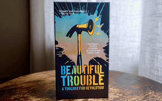 Beautiful Trouble strategy card deck box with illustrated bird and bold title