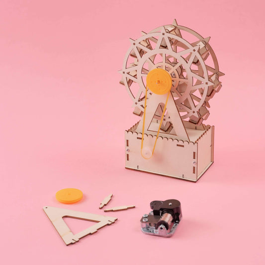 Ferris wheel music box DIY kit with wooden gears, crank base, and included parts