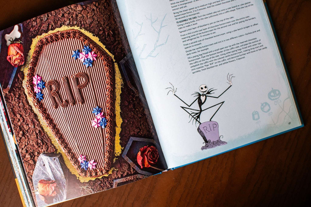 Open cookbook featuring a chocolate coffin cake recipe and Jack Skellington illustration