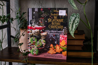 The Nightmare Before Christmas cookbook front cover with themed recipes and food photography