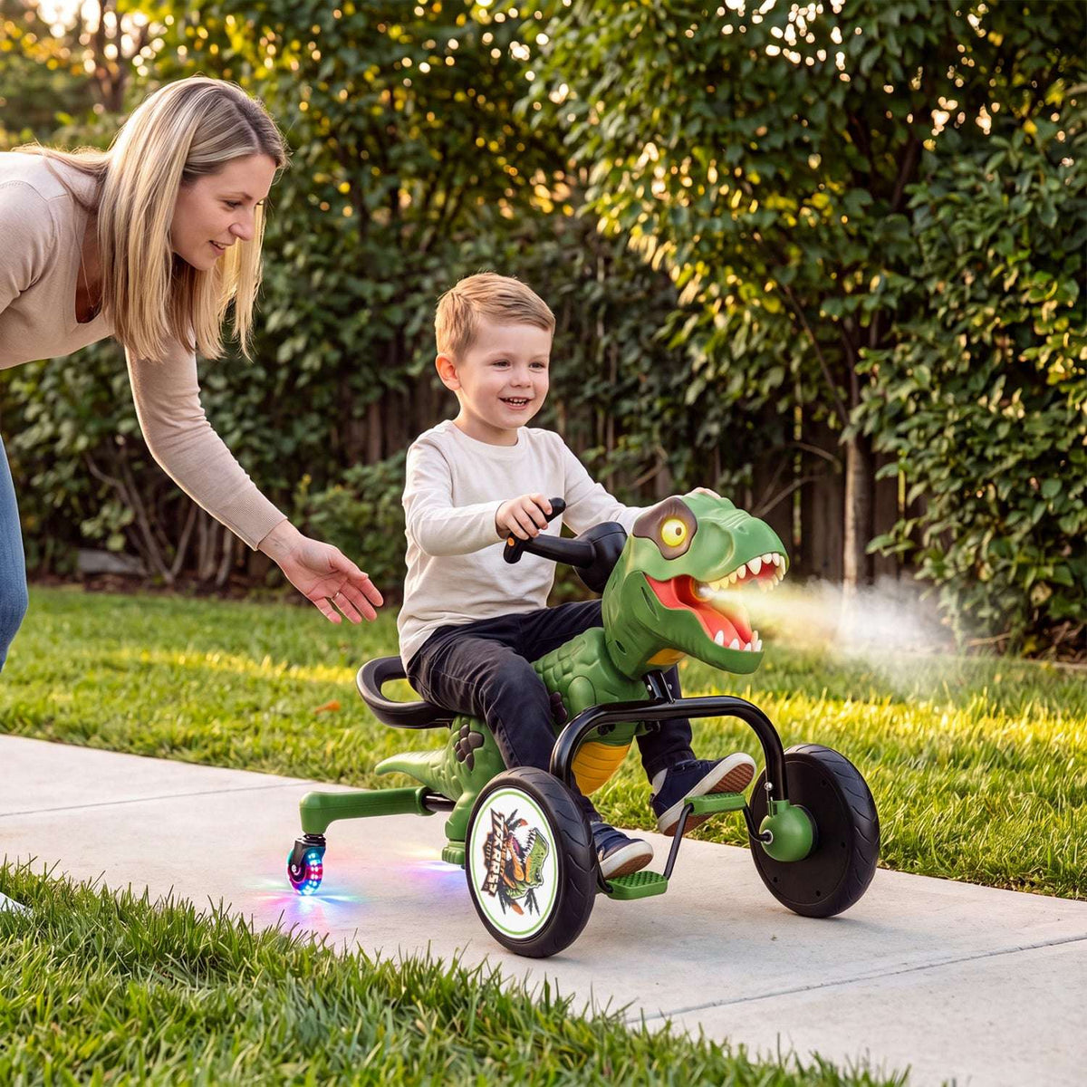 Green dinosaur tricycle with spray mist, lights, and smiling child rider on wheels