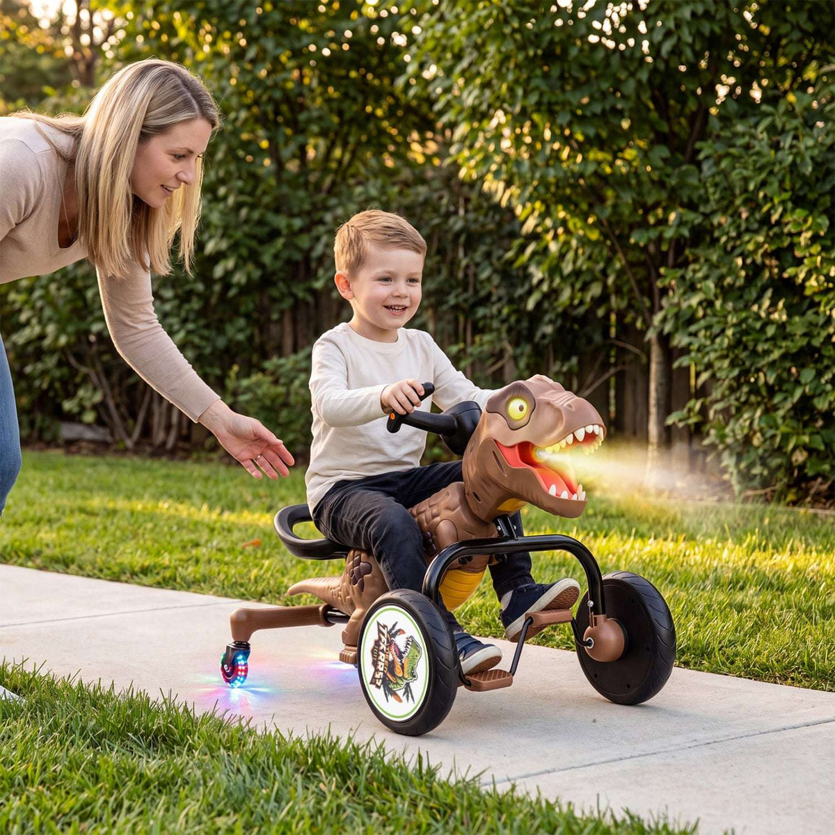 Green dinosaur tricycle toy with spray mist and light-up accents while child rides