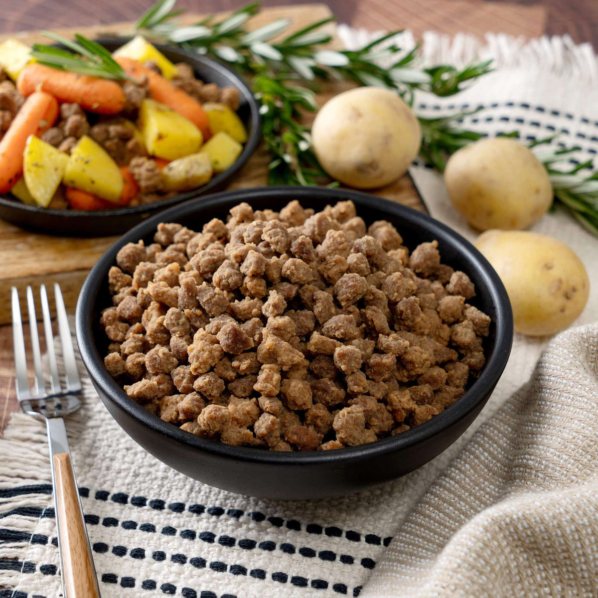 Freeze-dried meat crumbles in a black bowl