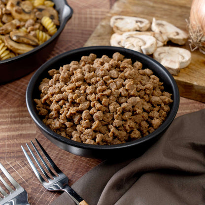 Close-up of freeze-dried meat crumbles in a black bowl