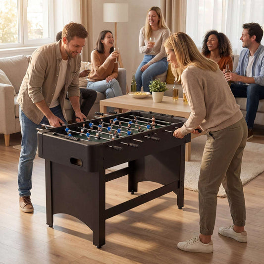 Black foosball table with blue-and-green player field, full-size with sturdy legs.