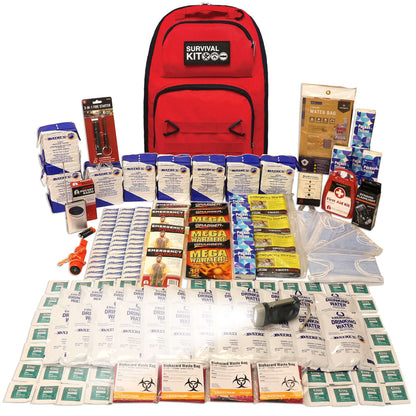 Red survival kit backpack with water packets, blankets, and assorted emergency supplies
