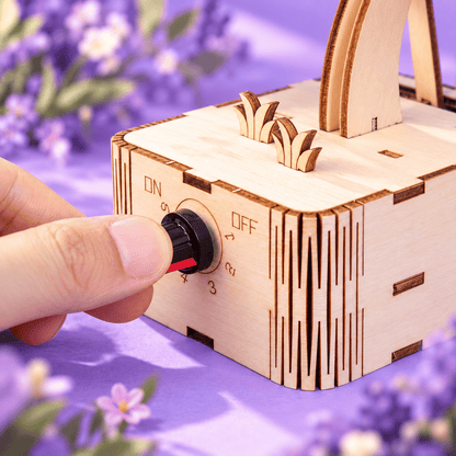 Wooden butterfly kit close-up with hand turning the side control knob