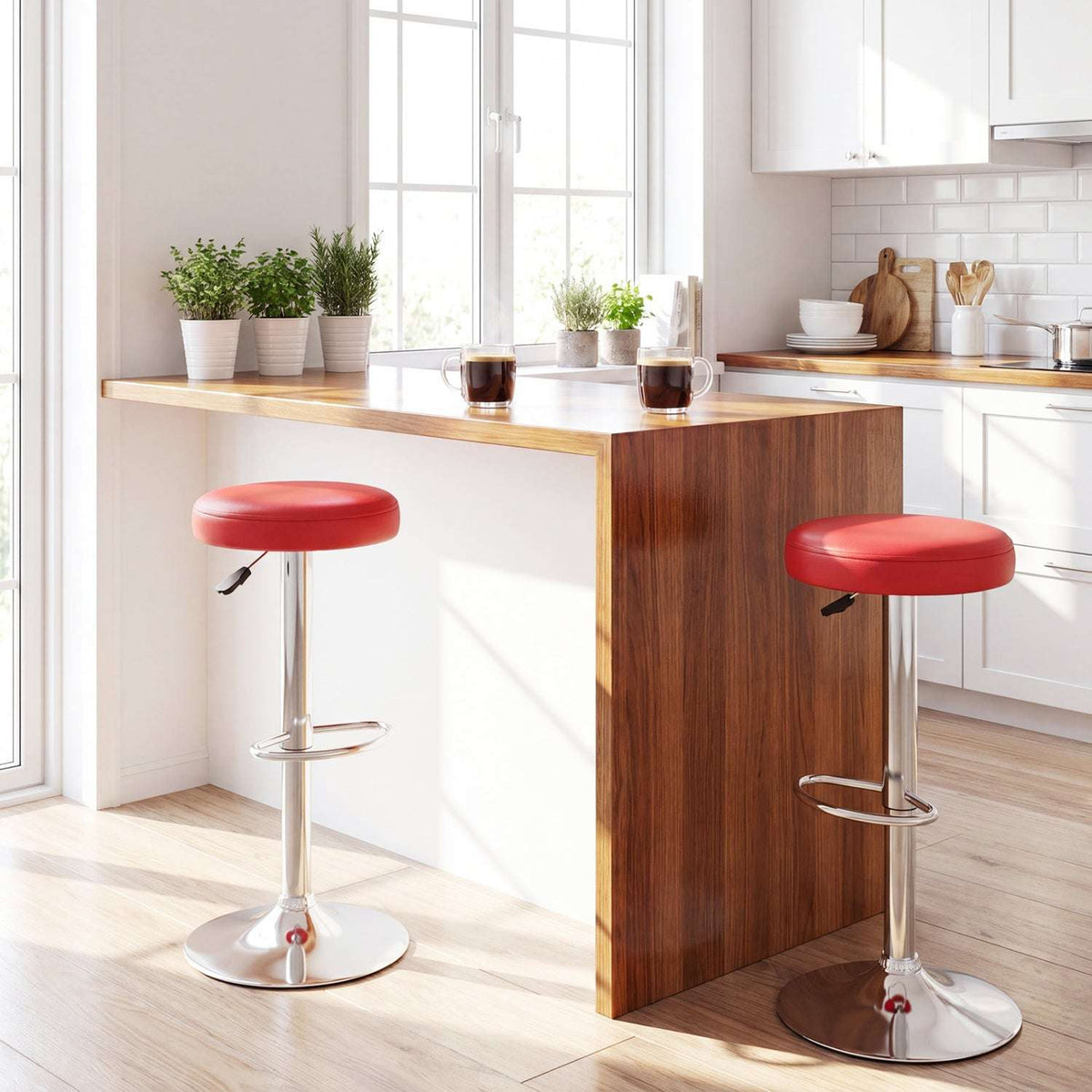 Two red adjustable swivel bar stools with padded seats, chrome pedestals and round bases
