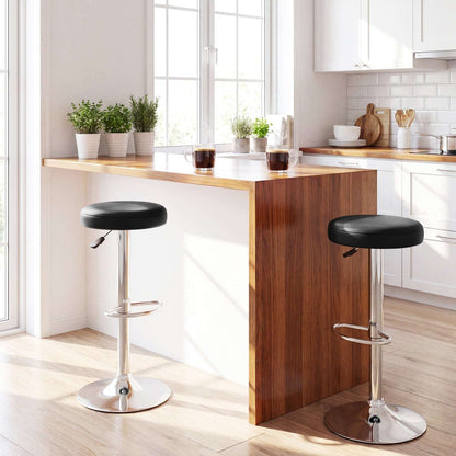 Two black adjustable swivel bar stools with padded seats, chrome pedestals and round bases