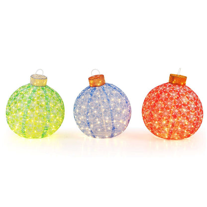 Three pre-lit Christmas ball ornaments with patterned mesh in green, blue, and red